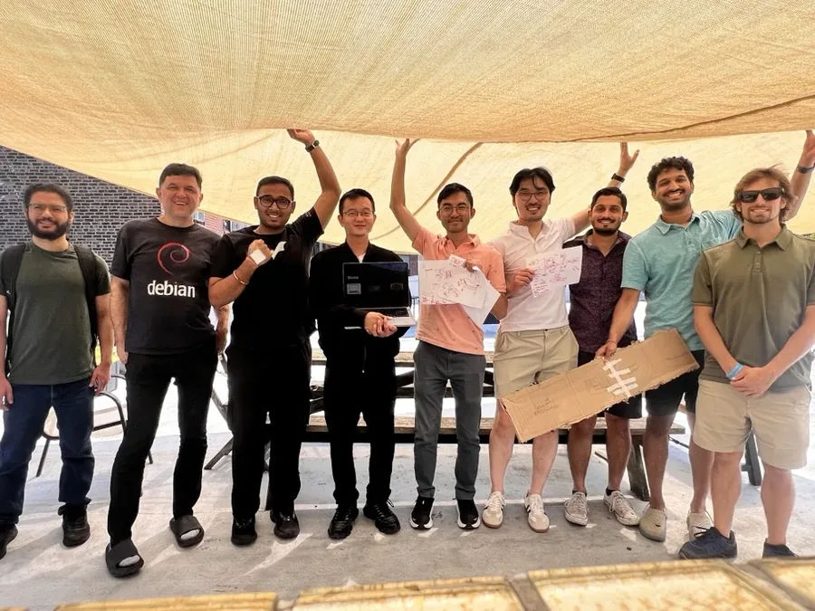 The teams under a shade sail on the Fractal Tech roof